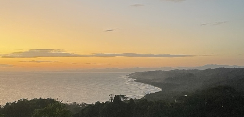 Sunset over Santa Teresa bay from the hill at Mal País